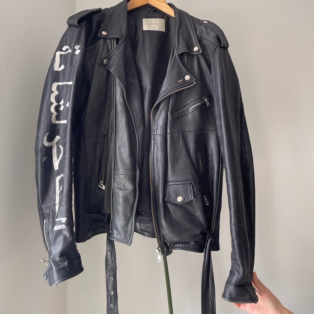 Deadwood leather biker jacket with hand painted Arabic lettering